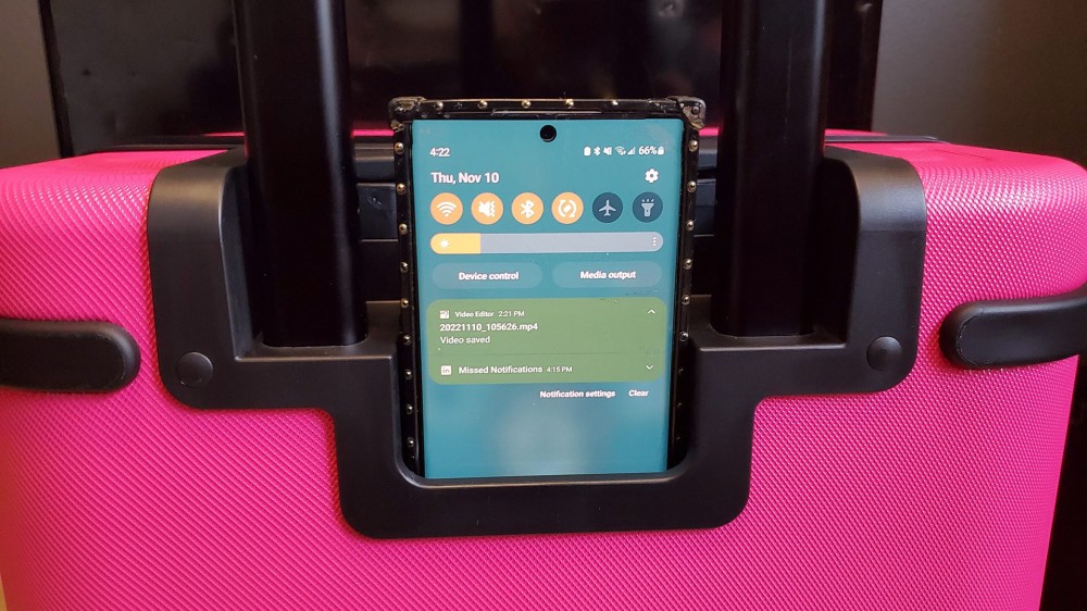 The T-Mobile Samsara Un-carrier On smart suitcase with a phone in the holder.