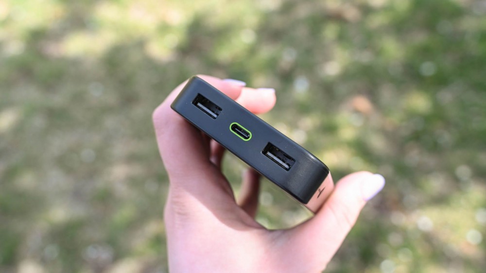 Person holding the Mophie Powerstation to show usb ports