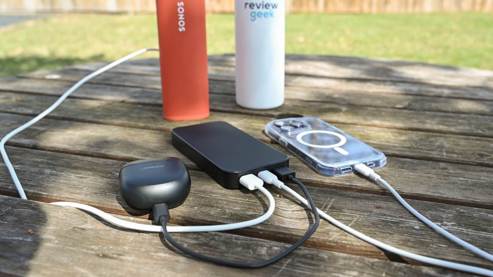 Charging three devices at once on a picnic table using the Mophie Powerstation