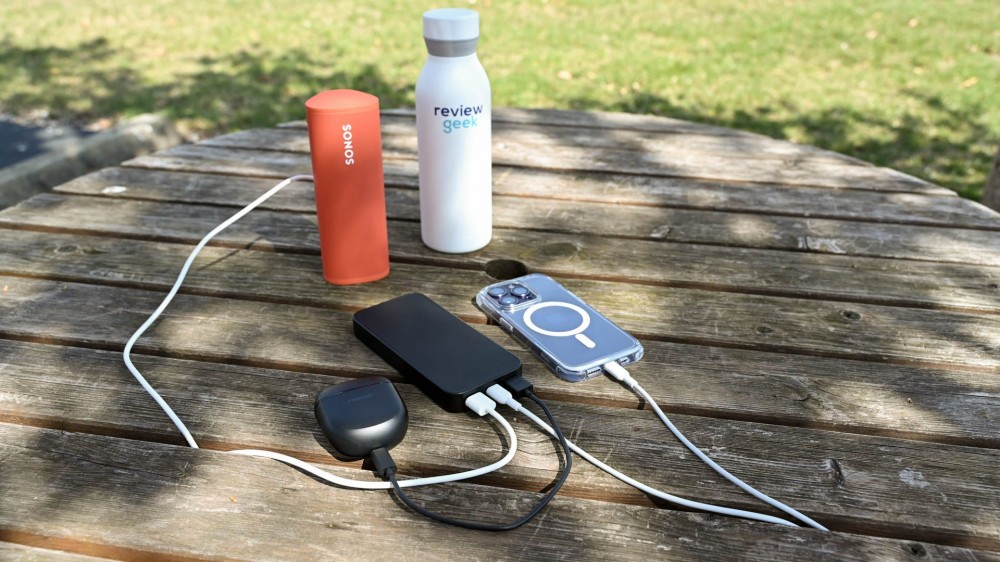 Charging three devices at once on a picnic table using the Mophie Powerstation