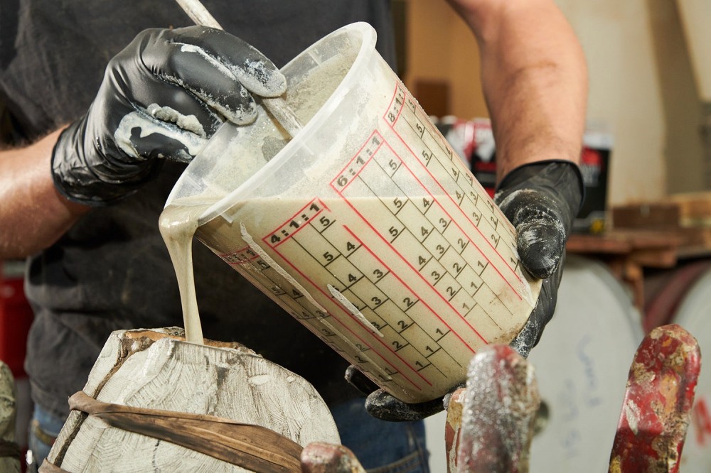 pouring thick liquid into mold